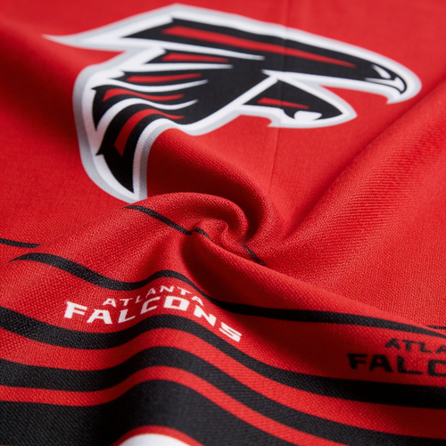 Close-up of Atlanta Falcons logo and text on a red background