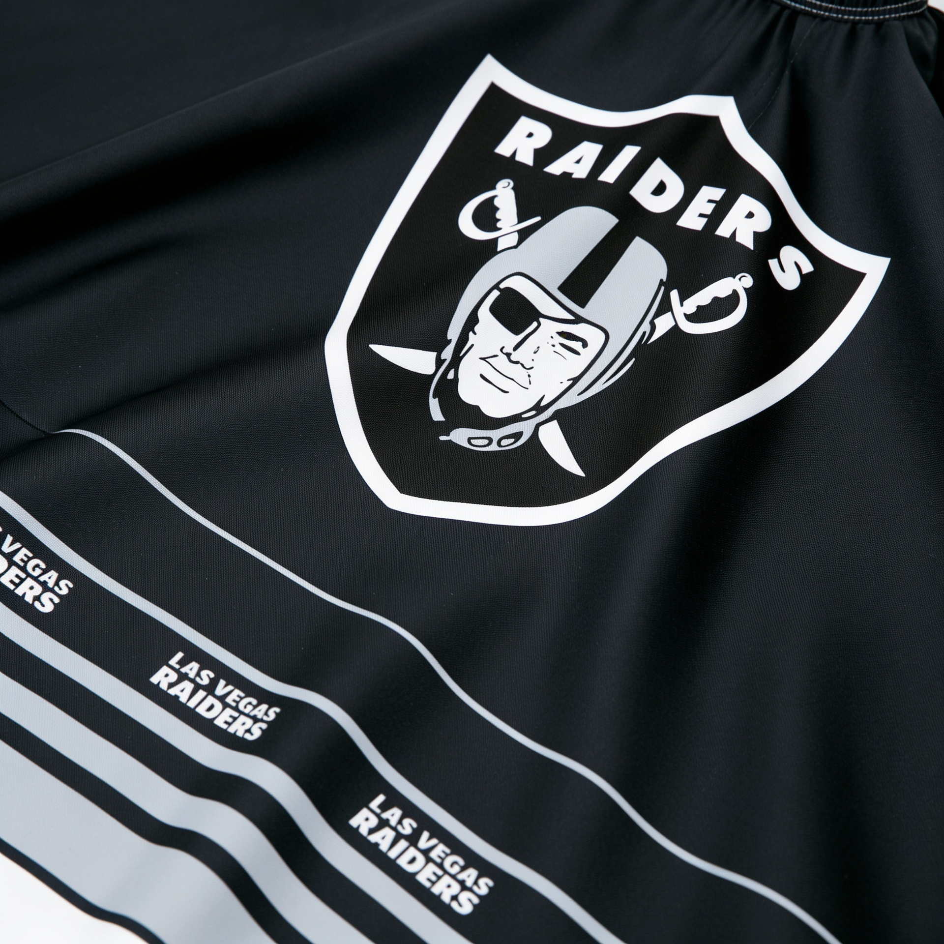 Black shorts with Las Vegas Raiders logo and text on a black background